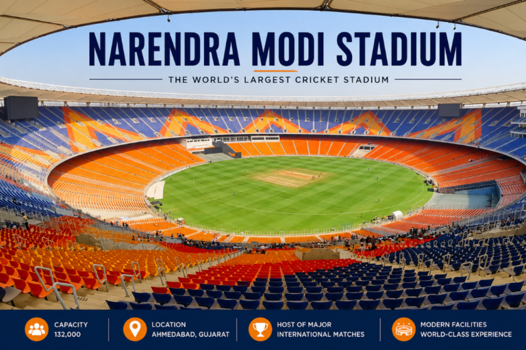 Panoramic view of Narendra Modi Stadium in Ahmedabad showing the cricket field, colorful seating, and modern stadium infrastructure.
